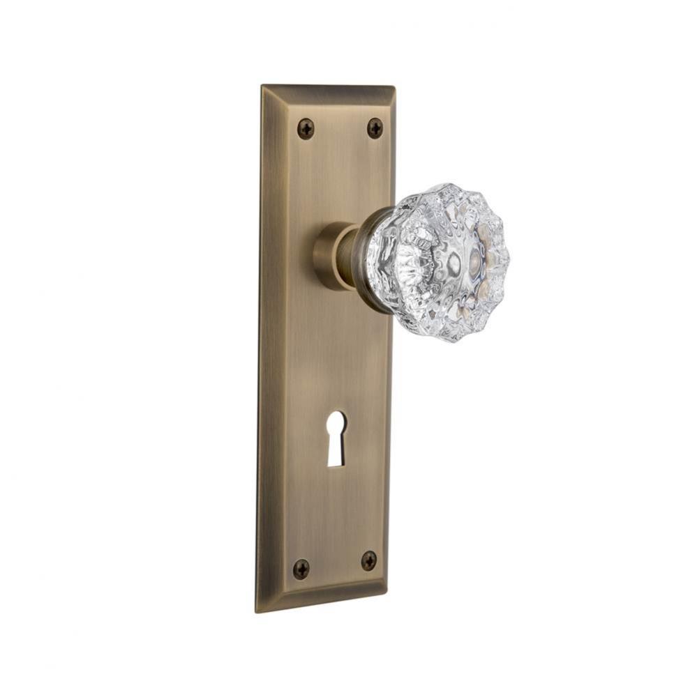 Nostalgic Warehouse New York Plate with Keyhole Privacy Crystal Glass Door Knob in Antique Brass