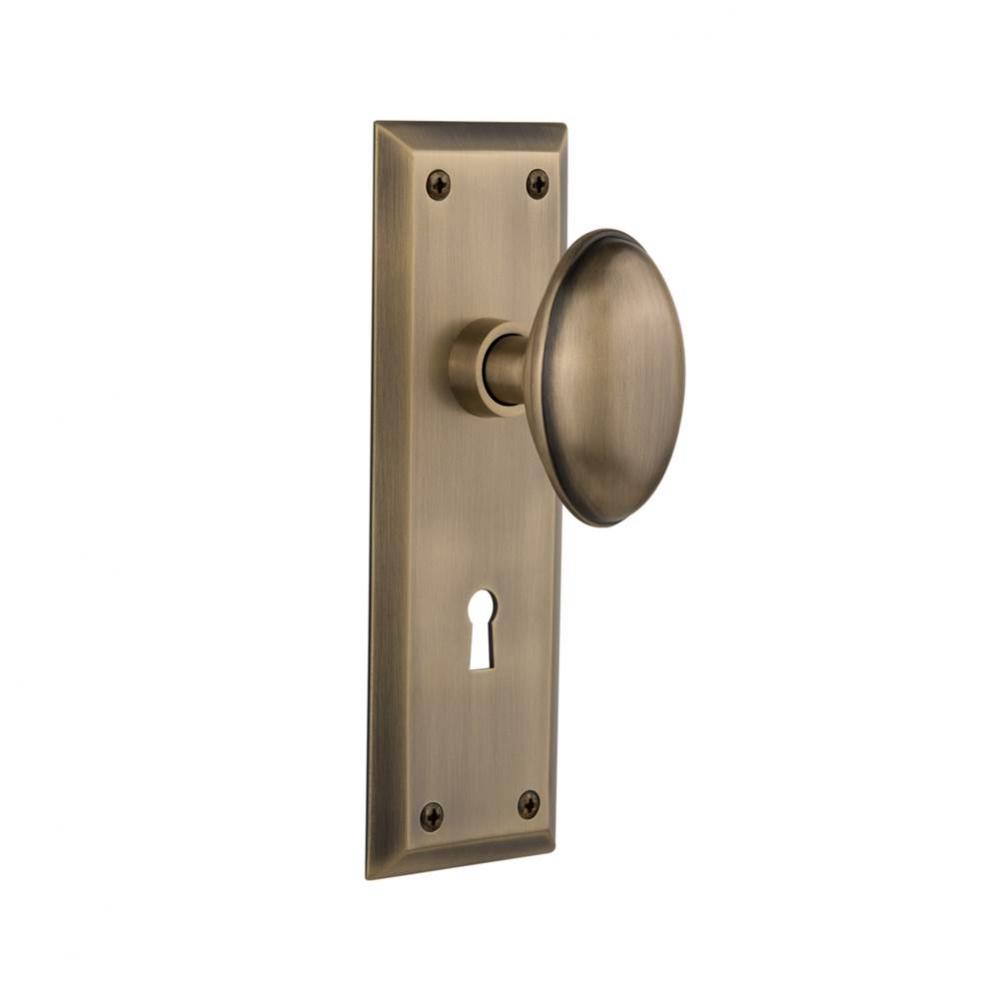 Nostalgic Warehouse New York Plate with Keyhole Privacy Homestead Door Knob in Antique Brass