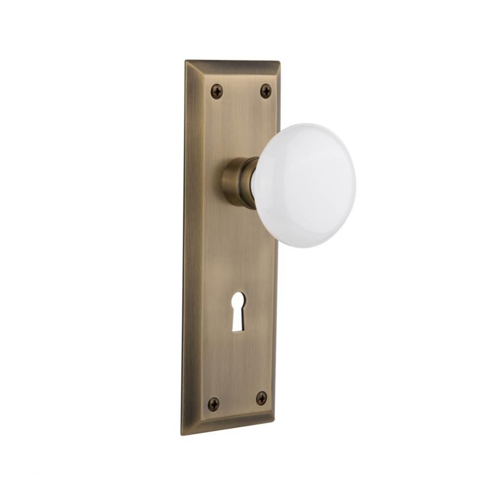 Nostalgic Warehouse New York Plate with Keyhole Passage White Porcelain Door Knob in Antique Brass