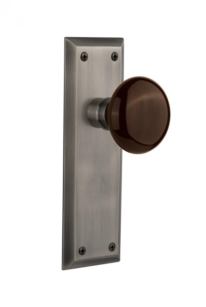Nostalgic Warehouse New York Plate Passage Brown Porcelain Door Knob in Antique Pewter