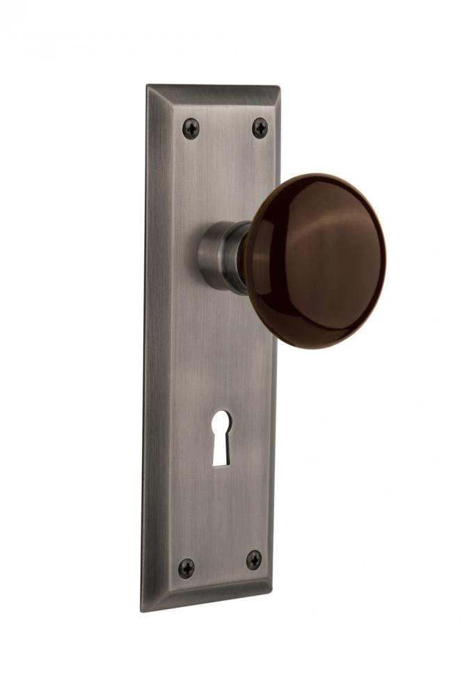 Nostalgic Warehouse New York Plate with Keyhole Passage Brown Porcelain Door Knob in Antique Pewte