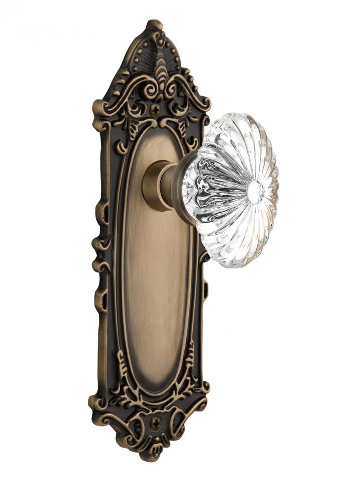 Nostalgic Warehouse Victorian Plate Passage Oval Fluted Crystal Glass Door Knob in Antique Brass