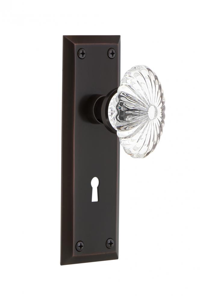 Nostalgic Warehouse New York Plate with Keyhole Passage Oval Fluted Crystal Glass Door Knob in Tim