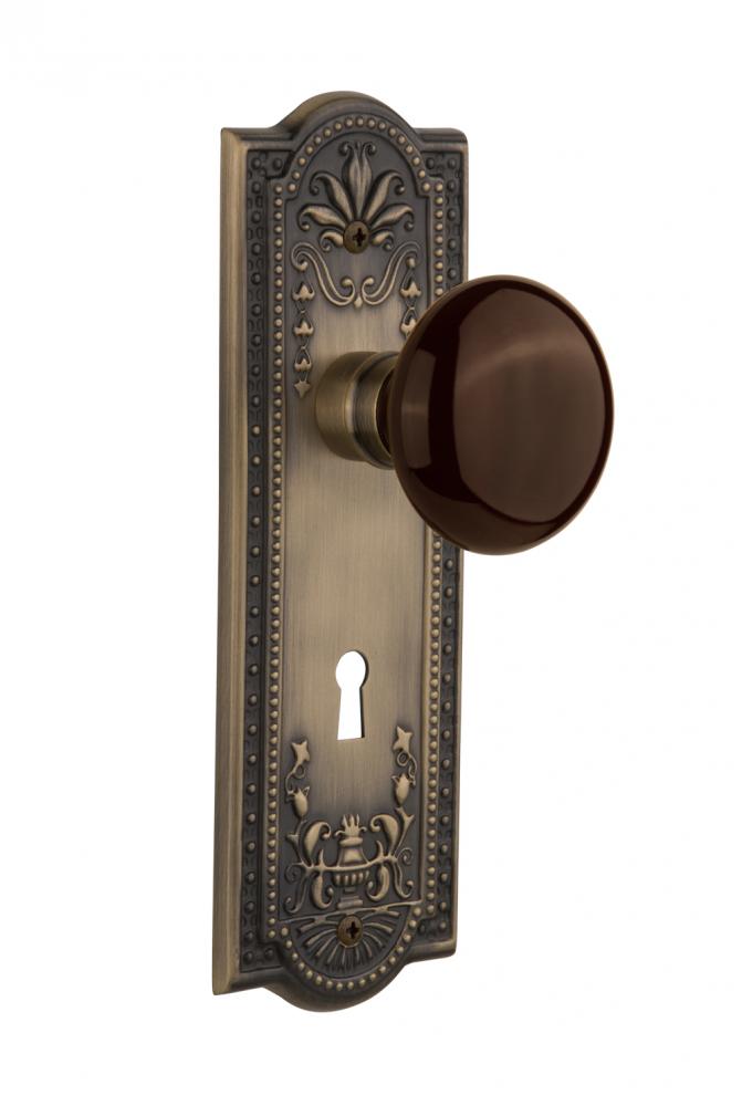 Nostalgic Warehouse Meadows Plate with Keyhole Privacy Brown Porcelain Door Knob in Antique Brass