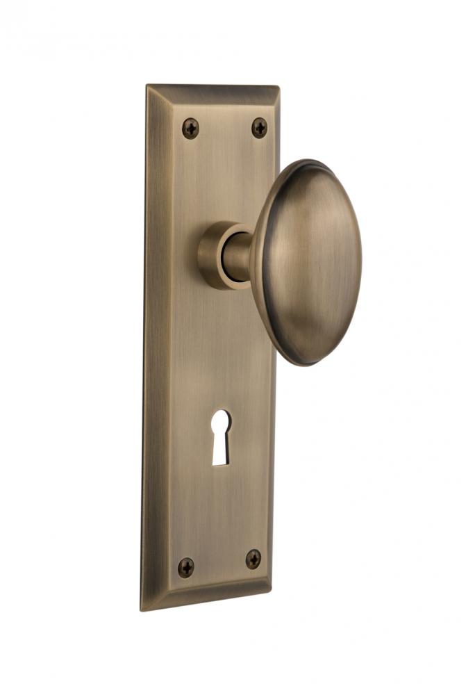Nostalgic Warehouse New York Plate with Keyhole Privacy Homestead Door Knob in Antique Brass
